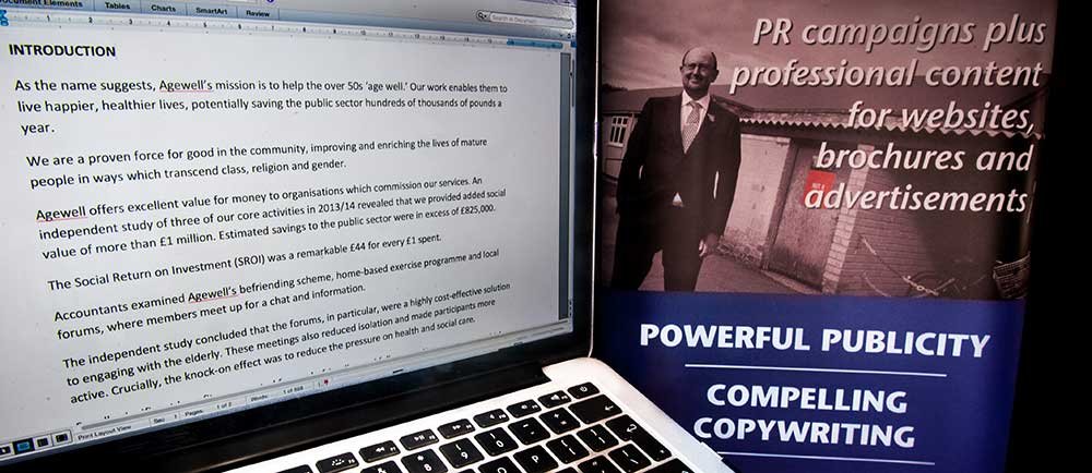 Laptop computer screen and picture of Phil Shanahan promoting Enigma Communications' PR, ad and web content writing services