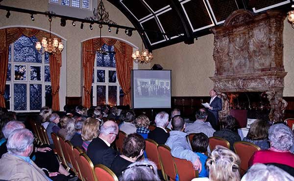 Phil Shanahan giving talk to packed audience in The Music Room at Grims Dyke Hotel about his book, The Real Enigma Heroes.