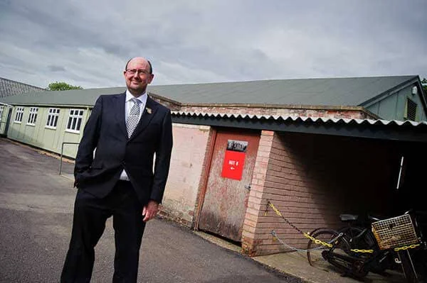 Phil Shanahan, managing editor of Enigma Communications, outside Hut 8 at Bletchley Park. He opened the hut to the public.